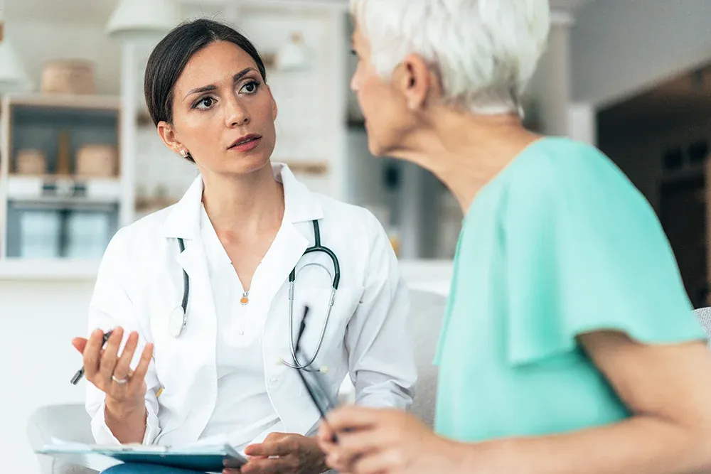 Healthcare worker with elder woman