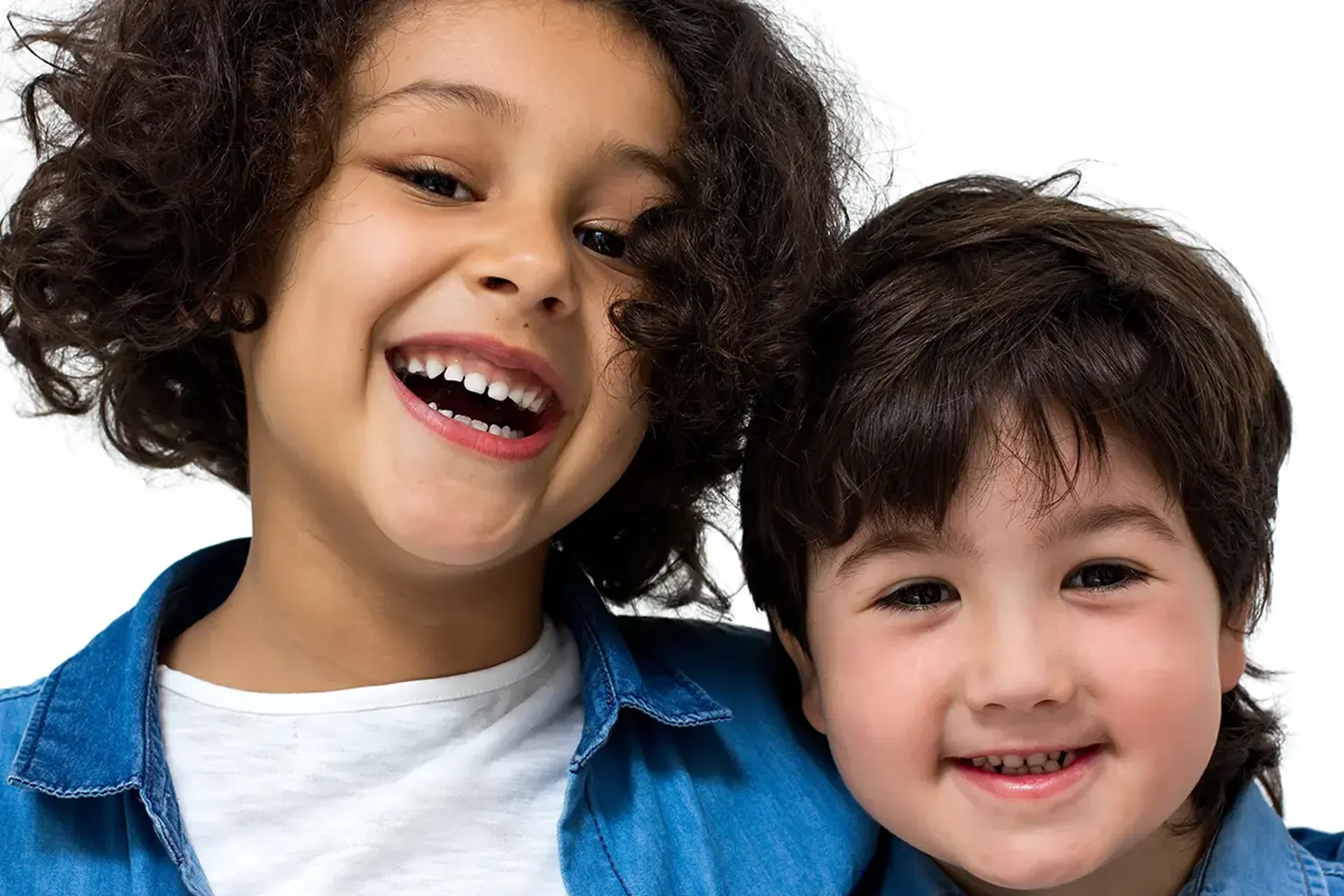 Girl and boy siblings smiling in closeup