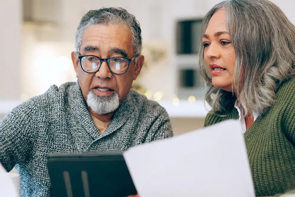 Senior couple discussing documents