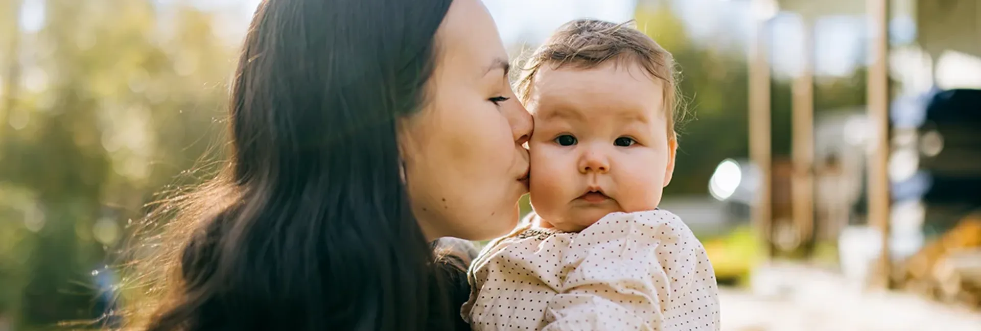 Mother Embracing Her Cute Baby at Alaskan Home