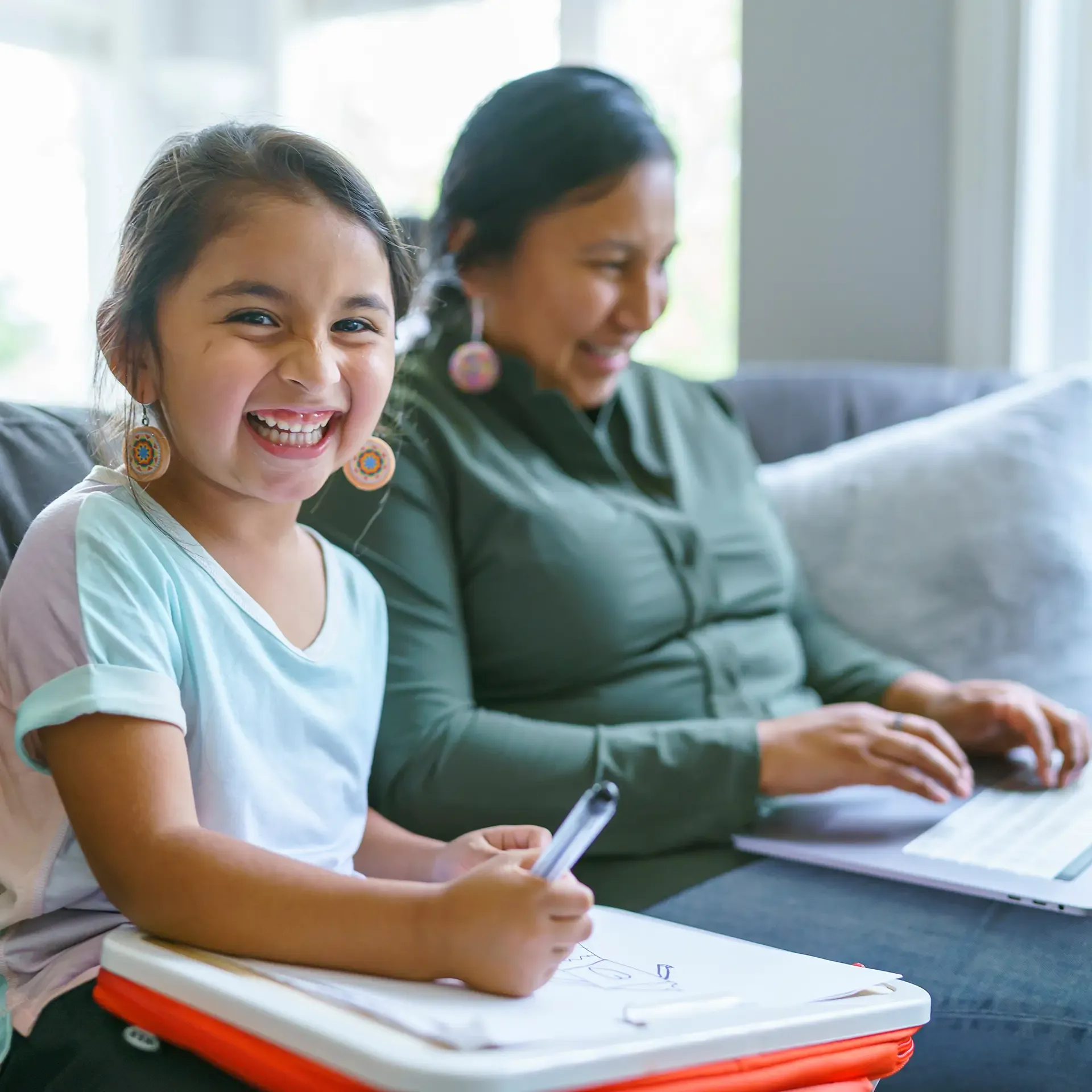 Happy Native American girl spending time with her mom