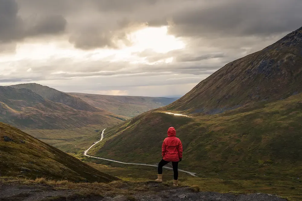 Hiker at mountain top of the Hatcher Pass, Alaska