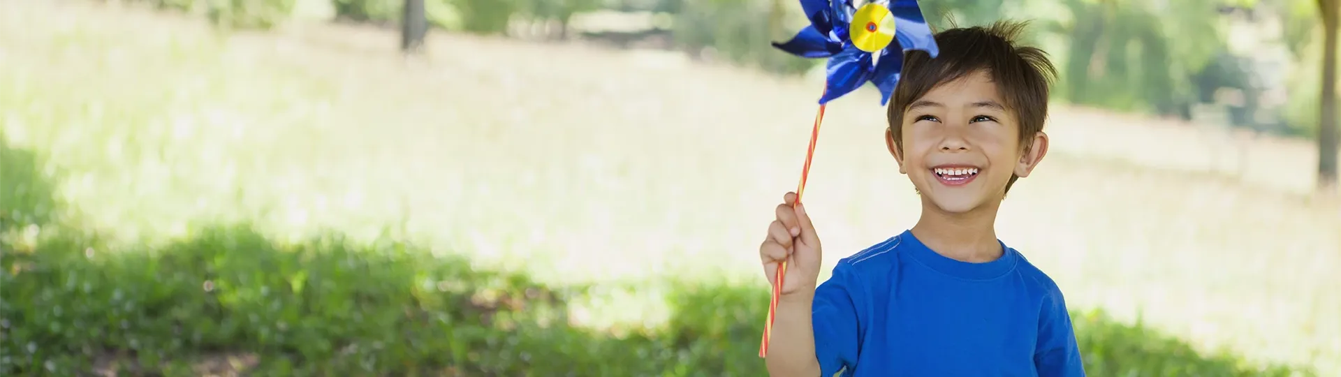 Child with blue pinwheel