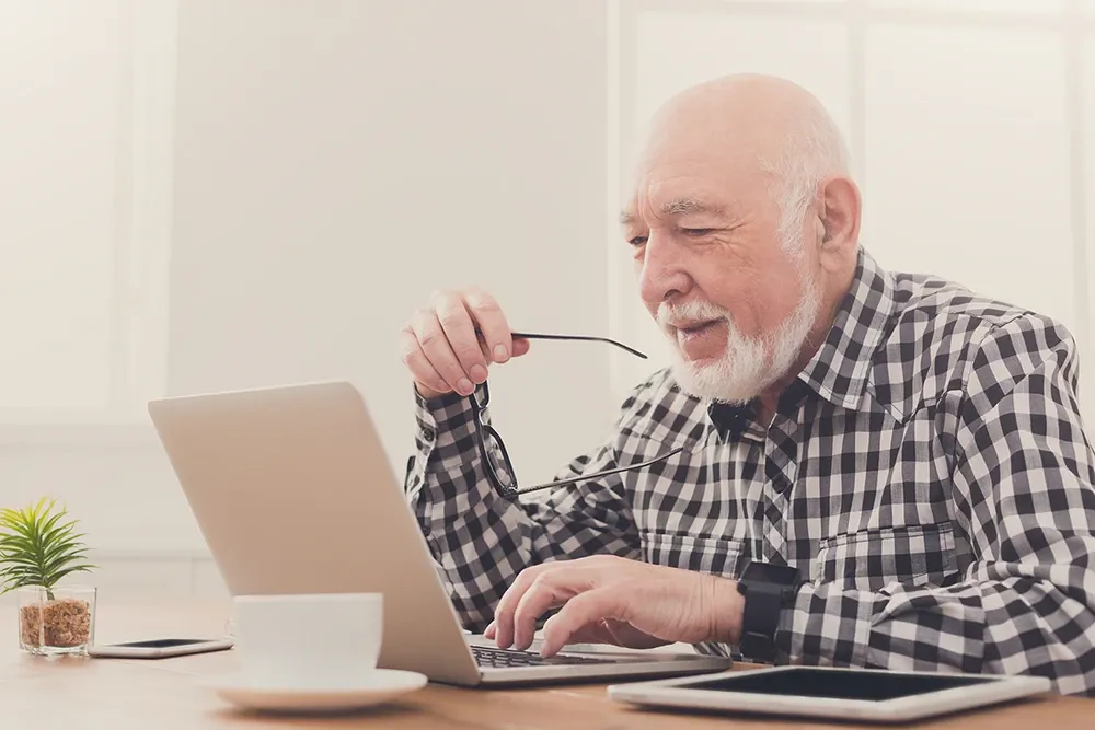 Older man working on computer