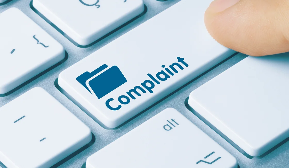 Keyboard with 'Complaint' printed on a key
