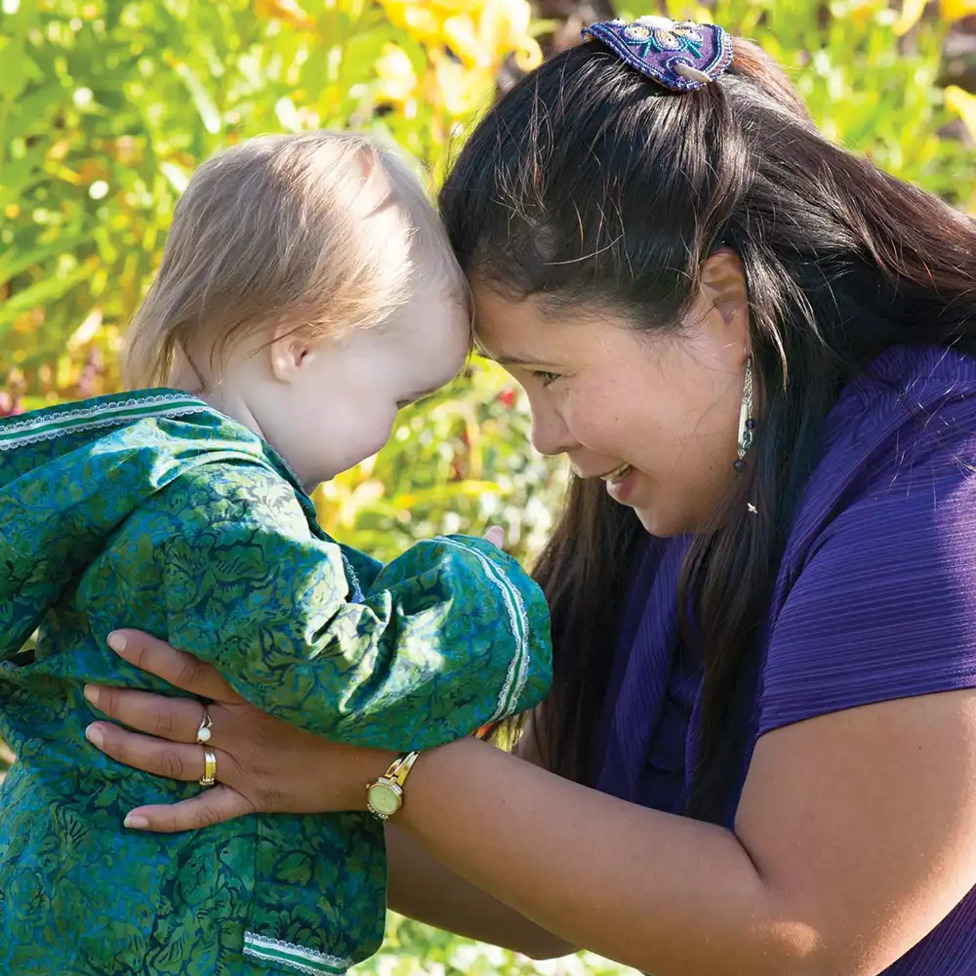 Mother and child, touching foreheads