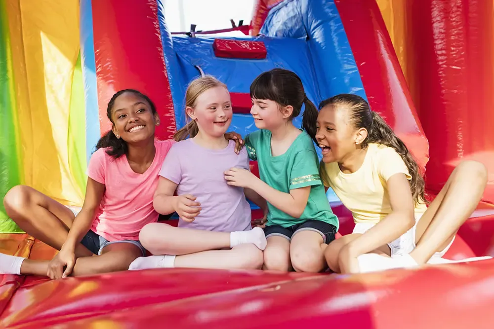 Girlfriends in bounce house