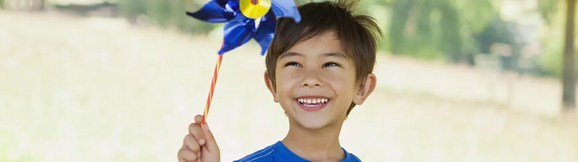 Child with blue pinwheel