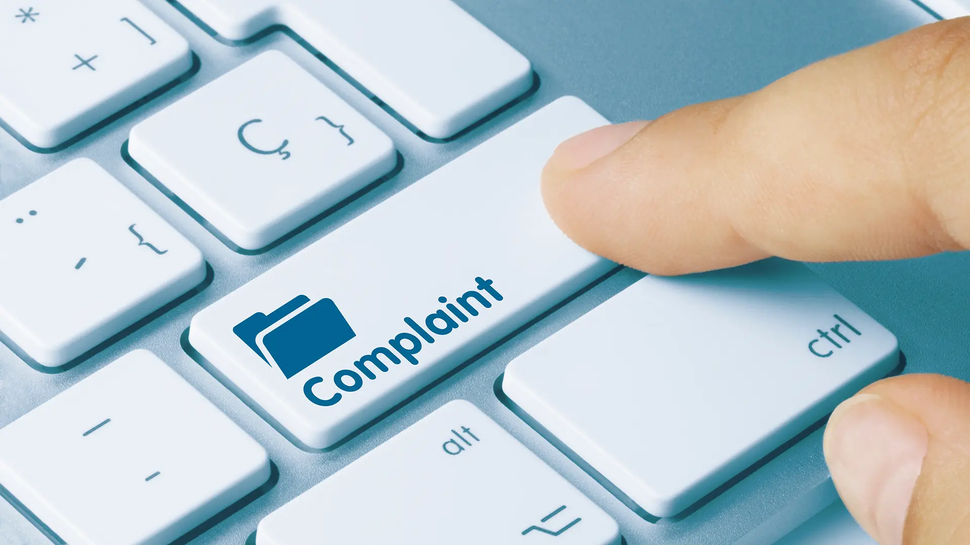 Keyboard with 'Complaint' printed on a key
