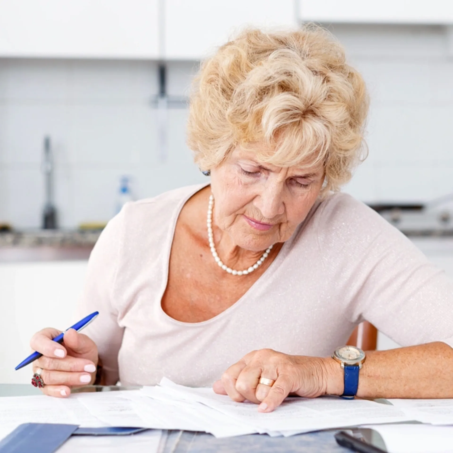 Elder woman completing paperwork