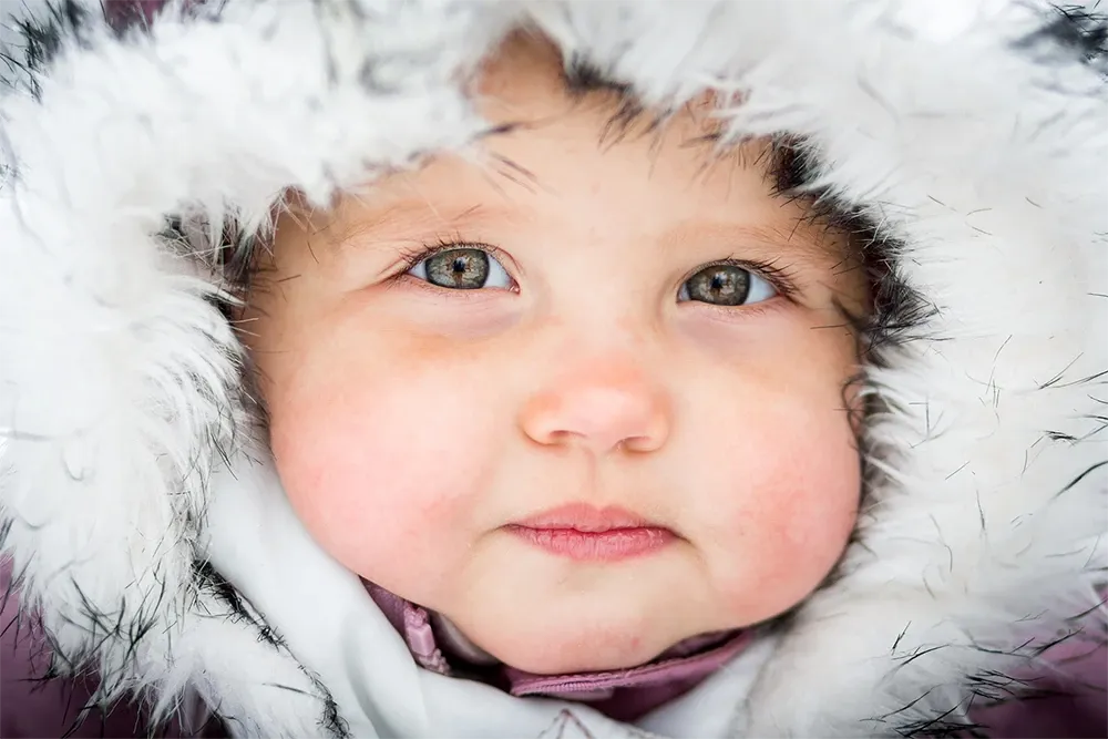 Baby in a fur-lined hood
