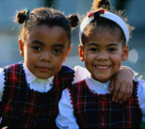 Sisters wearing the same outfits